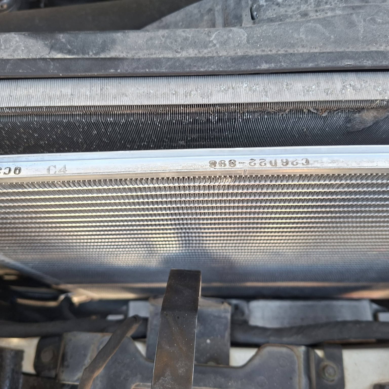 New condenser fitted at the front of the Nissan with the bumper off