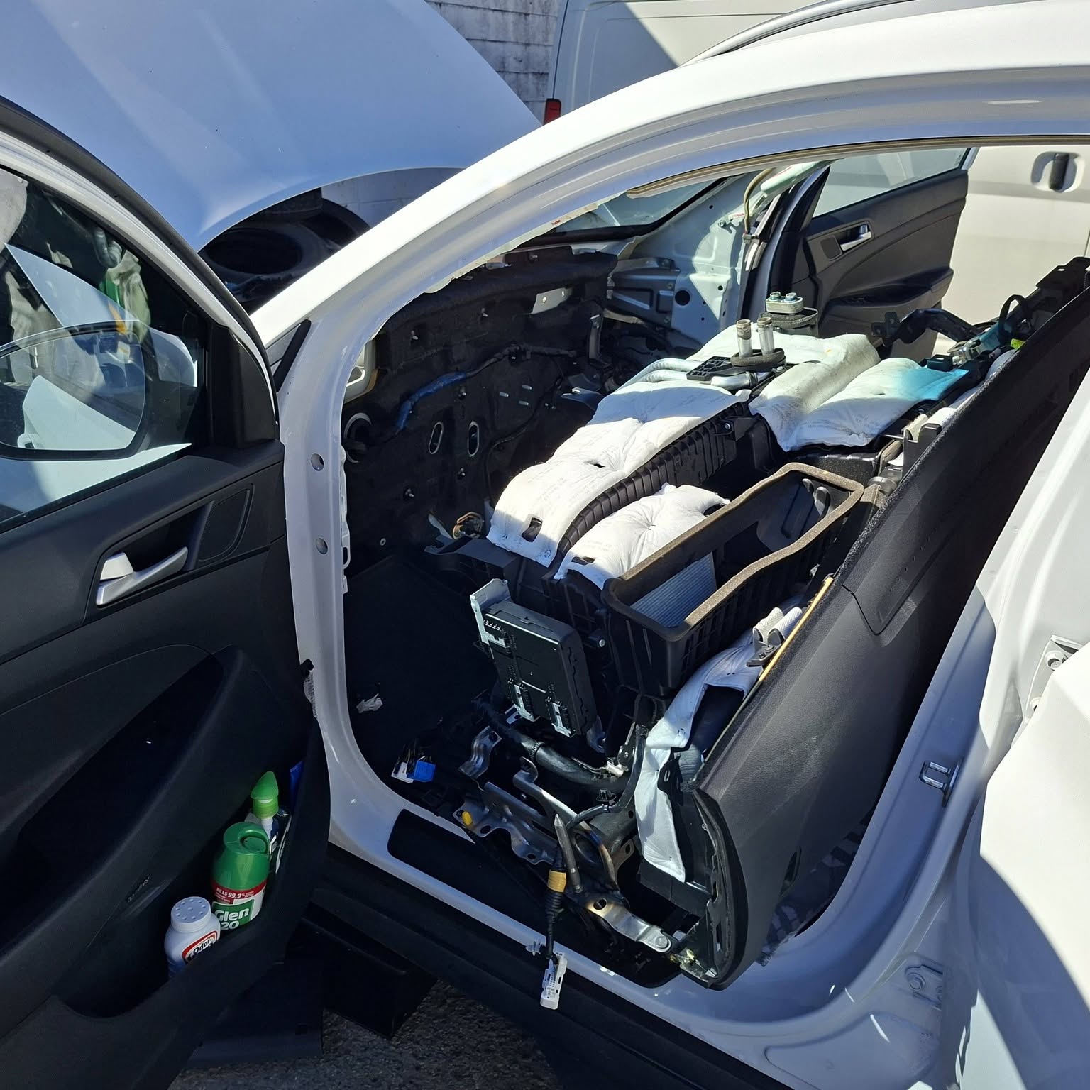 Hyundai with the dashboard pulled out through the driver's door